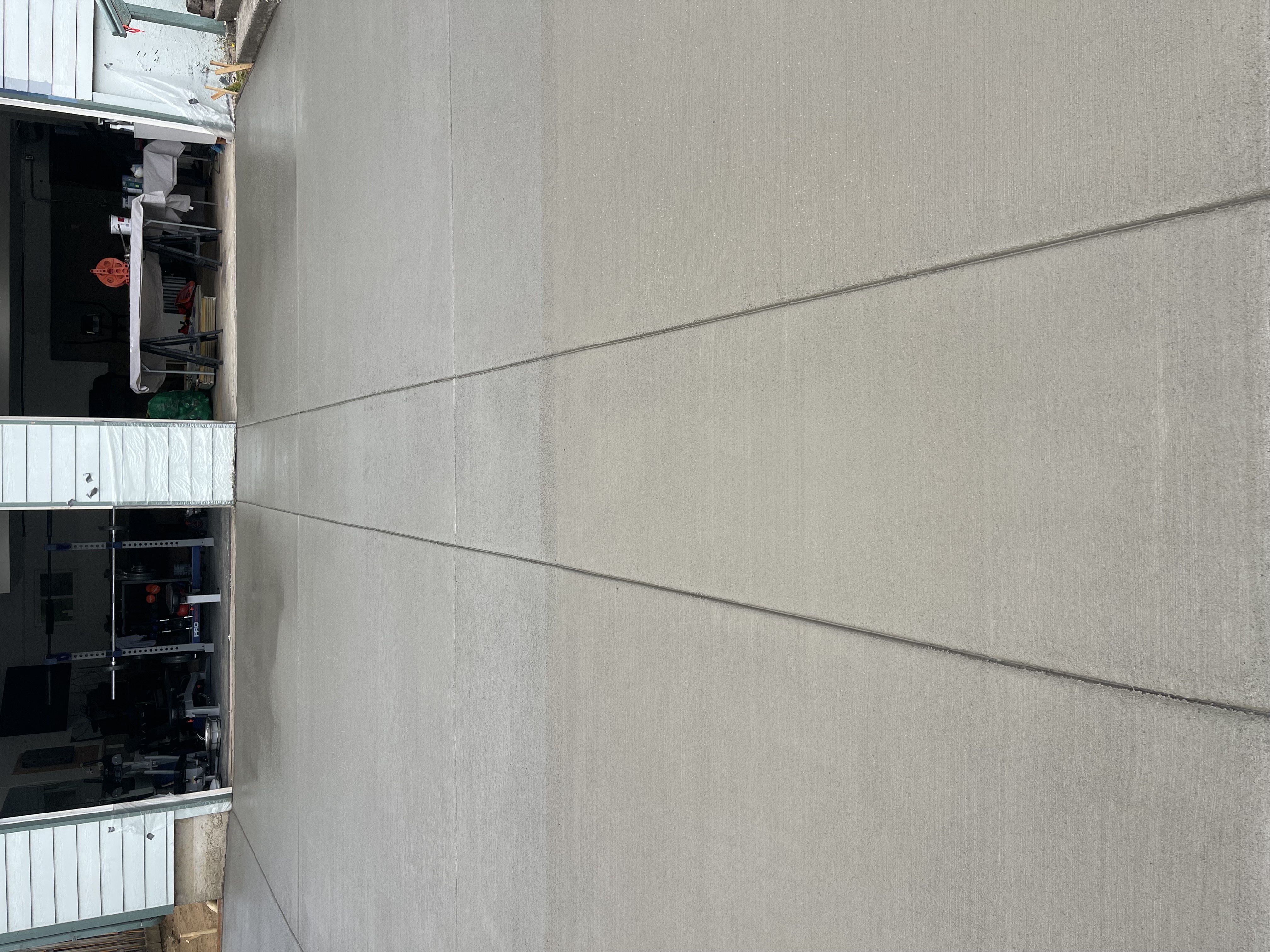 Wide angle of a new concrete driveway